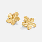 Madeleine – Boucles d’oreilles dorées en forme de fleur.